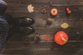 Autumn background with copy space. Female legs and pumpkins on the wooden background