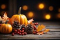 Autumn background from fallen leaves and fruits with vintage place setting on old wooden table. Thanksgiving day concept