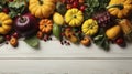 Autumn background from fallen leaves and fruits with vintage place setting on old wooden table. Thanksgiving day concept