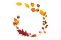 Autumn background with natural decor. Wreath made of autumn dried leaves. Flat lay, top view. Copy space for seasonal promotions
