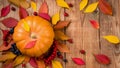 Autumn background with pumpkin, berries and maple leaves on tree. Royalty Free Stock Photo
