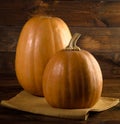 Autumn background with pumpkin on wooden board
