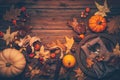 Rustic autumn still life with pumpkins and golden leaves on a wooden surface Royalty Free Stock Photo