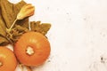 Autumn background with pumpkins and leaves, gray table, top view Royalty Free Stock Photo