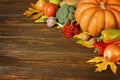 Autumn background with seasonal autumn nature pumpkins, vegetables and berries on the wooden table