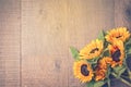 Autumn background with sunflowers on wooden table. View from above. Retro filter effect Royalty Free Stock Photo