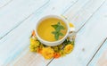 Autumn background. Tea mug with mint and autumn flowers on a wooden background. Concept Autumn Time Fall Royalty Free Stock Photo