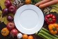 White empty plate with various vegetables top view Royalty Free Stock Photo