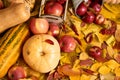 Autumn background from yellow leaves, apples, pumpkin. Fall season, eco food and harvest concept Royalty Free Stock Photo