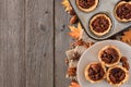 Autumn baking scene side border with pecan tarts over wood