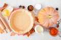 Autumn baking table scene with pumpkin pie ingredients Royalty Free Stock Photo