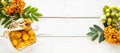 Autumn banner. Paradise apples in sugar syrup on a white wooden background. Harvesting. Paradise apple jam. Top view. Copy space