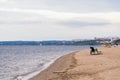 Autumn beach on the Volga. The lonely figure of a woman on the bench. The City Of Samara, Russia