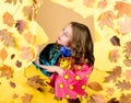 Autumn beauty. Happy childhood. little girl in rain protection. Fall fashion. season forecast. kid in autumn leaves Royalty Free Stock Photo