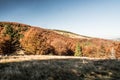 Autumn Beskid Zywiecki mountains with meadows, colorful forest and clear sky Royalty Free Stock Photo
