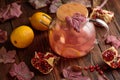Autumn Beverage: Pomegranate Tea with Lemon and Ginger on Rustic Table Royalty Free Stock Photo