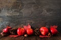 Autumn border of apples, leaves, and fall decor, side view on a dark stone background Royalty Free Stock Photo