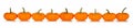 Autumn border of orange mini pumpkins isolated on white Royalty Free Stock Photo