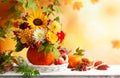 Autumn bouquet of beautiful flowers and berries in a pumpkin on wooden white table. Concept of autumn festive decoration for Royalty Free Stock Photo