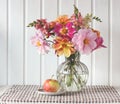 Autumn bouquet of dahlias and Apple. flowers in a glass vase Royalty Free Stock Photo