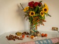 Autumn bouquet with sunflowers and roses and mini pumpkins around Royalty Free Stock Photo