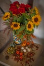 Autumn bouquet with sunflowers and roses and mini pumpkins around Royalty Free Stock Photo