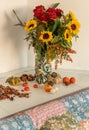 Autumn bouquet with sunflowers and roses and mini pumpkins around Royalty Free Stock Photo