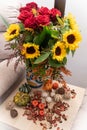 Autumn bouquet with sunflowers and roses and mini pumpkins around Royalty Free Stock Photo