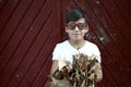 Autumn boy Portrait In Fall Yellow Leaves, Kid in Park Outdoor wearing glasses Royalty Free Stock Photo