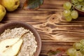 Autumn. Breakfast. Oatmeal with pears in a clay bowl. Royalty Free Stock Photo