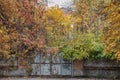 A rich palette of autumn colors on the example of an abandoned square of an old estate behind a new fence Royalty Free Stock Photo