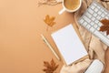Autumn business concept. Top view photo of paper sheet envelope pen computer mouse keyboard cup of coffee fallen maple leaves and Royalty Free Stock Photo