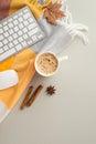 Autumn business concept. Top view vertical photo of workplace yellow maple leaf keyboard computer mouse cup of frothy coffee anise Royalty Free Stock Photo