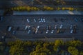 Autumn car parking in the industrial zone. Drone view.