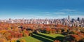 Autumn Central Park in NYC with downtown skyscrapers view from drone. Aerial of NYC Central Park panorama in Autumn Royalty Free Stock Photo