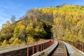 Autumn Circum-Baikal Railway on south lake Baikal with backpacker Royalty Free Stock Photo