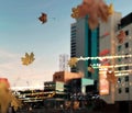 Autumn city   buildings evening blurred bokeh light street decoration and illumination and Autumn leaves fall urban scene Royalty Free Stock Photo