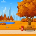 Autumn city park with bench under big tree and city background Royalty Free Stock Photo