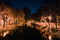 Autumn city park at night. Trees, river and street lights. Royalty Free Stock Photo