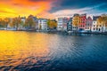 Autumn cityscape and water canal with houseboats in Amsterdam, Netherlands Royalty Free Stock Photo