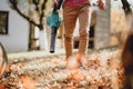 Autumn cleaning in backyard.Details of worker using leaf blower, garden blower and vacuum Royalty Free Stock Photo