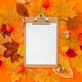 Autumn clipboard mockup with fall leaves