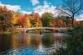 Autumn color and the Bow Bridge, at The Lake, in Central Park, Manhattan, New York City Royalty Free Stock Photo