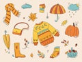 Autumn color doodles. Hand drawn color vector set of sketches: jumper, umbrella, boots, cloud, leaves, pumpkins. Autumn walking,