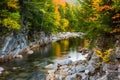 Autumn color and the Swift River at Rocky Gorge, on the Kancamagus Highway, in White Mountain National Forest, New Hampshire. Royalty Free Stock Photo