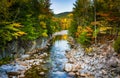 Autumn color and the Swift River at Rocky Gorge, on the Kancamagus Highway, in White Mountain National Forest, New Hampshire. Royalty Free Stock Photo