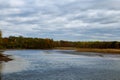 Autumn colored water view of sunset  picturesque nature with  river and yellowed  trees in the  .    landscape. Soft filter Royalty Free Stock Photo