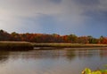 Autumn colored water view of sunset picturesque nature with river and yellowed trees in the . landscape. Soft filter applied Royalty Free Stock Photo