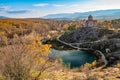 Autumn colorful picture of Cetina river source water hole and Orthodox church on the hill view, Dalmatian Zagora region of Croatia Royalty Free Stock Photo