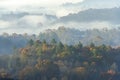 Autumn Colors and a Fog Mist over the Valley Royalty Free Stock Photo